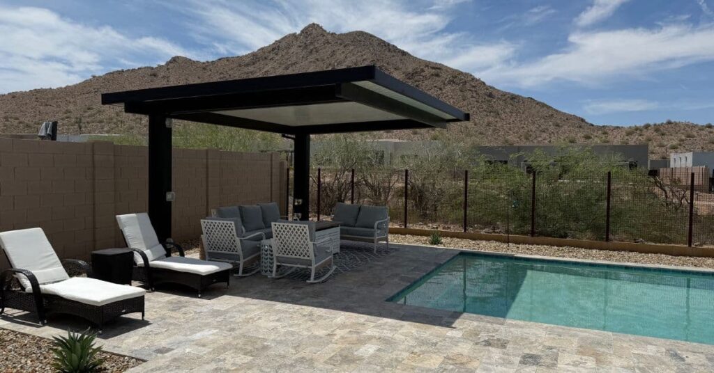 Custom Arizona backyard pool with shaded pergola and seating area built by Apricity Pools